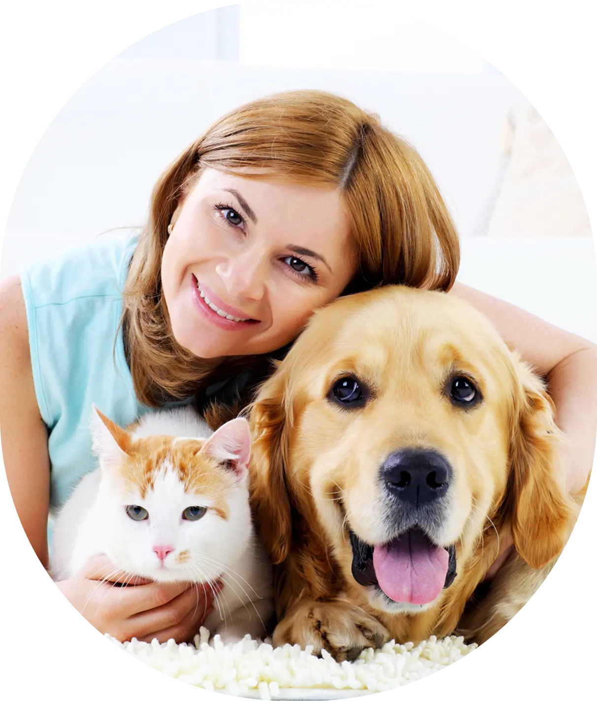 Woman with cat and dog smiling together.